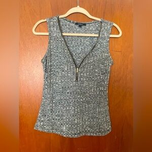 sleeveless, zip front shirt